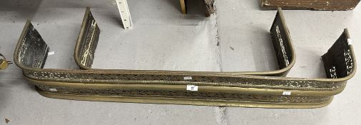 Two brass fire fenders, the larger 47ins. x 7½ins. The smaller 31½ins. x 6ins. Both with