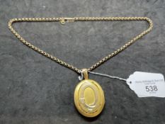 Jewellery: Yellow metal belcher link chain, 18ins. With an oval hinged locket 42mm x 36mm