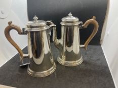 Hallmarked Silver: Coffee pot and hot water jug with hinged covers and scroll wooden handles.