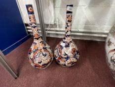 19th cent. Japanese bottle vases decorated in the traditional manner, a pair. (1 restored). 18ins.