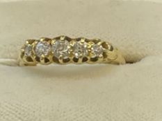 Jewellery: Yellow metal ring set with five graduated old cut diamonds, estimated weight of (5)
