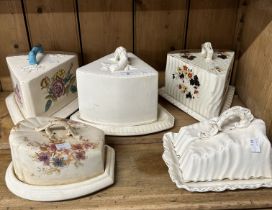 Staffordshire, five large cheese dishes all with floral decoration from various makers.