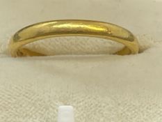 Jewellery: 22ct gold 3mm band. Hallmarked Birmingham, ring size T.