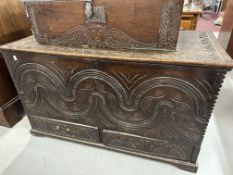 17th/18th cent. Oak mule chest with heavily carved front. 46ins. x 21ins. x 26ins.