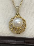 Jewellery: 9ct gold chain (18ins) with a pearl pendant attached, size of cultured pearl 7mm.