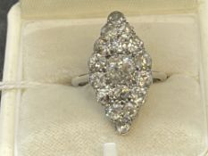 Jewellery: Early 20th cent. Marquise cut graduated diamond ring. The ring and mount test as