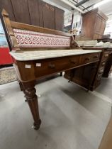 19th cent. Mahogany marble top washstand with red tile splashback.