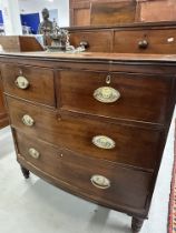 19th cent. Mahogany bow fronted two over two chest of drawers on turned supports and with original