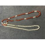 Jewellery: Pair of necklets one of 5.5mm cultured pearls with 9ct snap, 16ins, the other 6mm agate