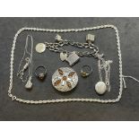Objects of Virtu/Jewellery: Items of silver jewellery brooch, charm bracelet, necklets.