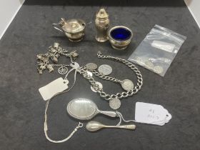 Silver: Charm bracelet and fourteen assorted charms attached, watch Albert with nine coins and a St.