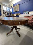 Antiques: 19th cent. Rosewood drum table with eight drawers, brass lion head handles