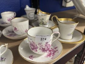 Continental Ceramics: Berlin K.P.M. Magenta floral decorated cups and saucers x 3