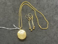 Jewellery: Yellow metal oval hinged locket on a 16ins rope link chain, plus a pair of ball