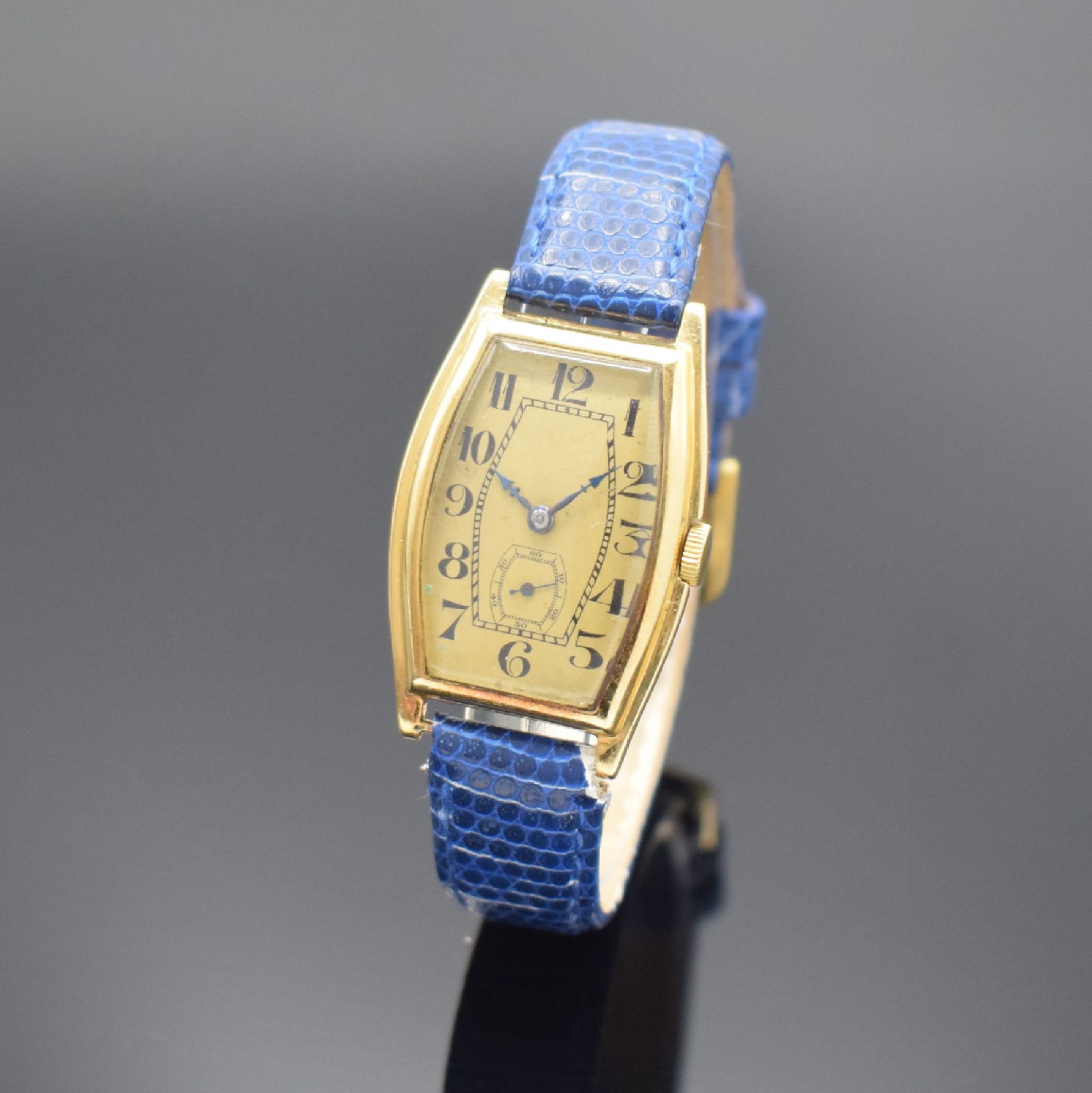Frühe tonneauförmige Armbanduhr in GG 750/000,  Schweiz um