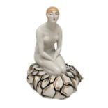 JEAN BOYER ART DECO LIMOGES PORCELAIN SCULPTURE/LAMP A kneeling female nude figure sitting on a cush