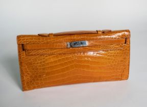 HERMÈS ORANGE KELLY CUT CLUTCH