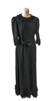 BLACK CREPE DRESS WITH A FLORALPATTERNED SATIN BELT, CIRCA 1920S