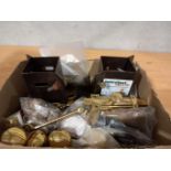 A Box Including Brass Door Knobs, Window Fittings, 2 Post Holders Etc