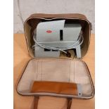 A Gnome Alphax Slide Projector In Leather Bag