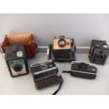 Box Including Old Cameras