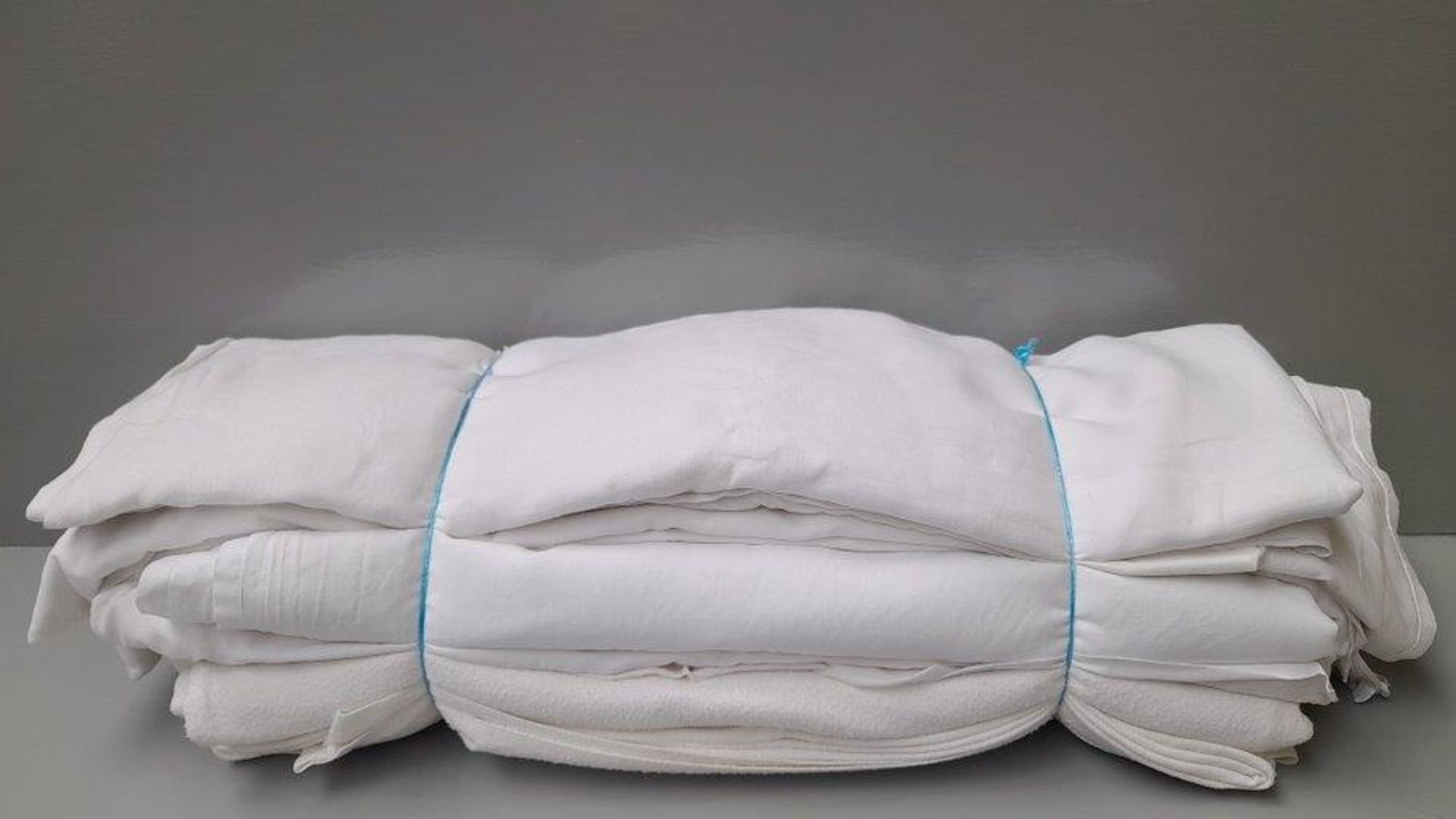 Bundle Of White Bed Linen