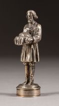 A SILVER FIGURE OF A RUSSIAN PEASANT PRESENTING A LOAF OF BREAD AND SALT THRONE