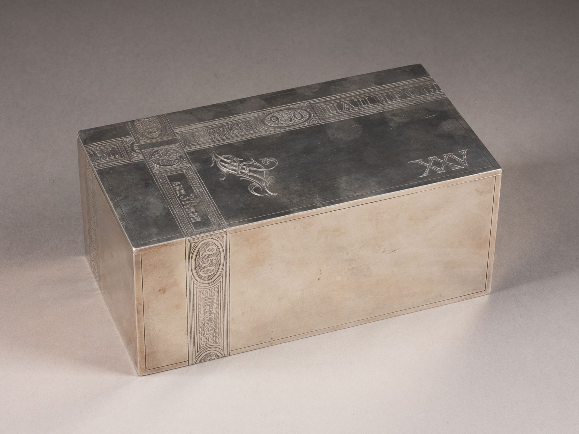 A SILVER TROMPE L'OEIL CIGAR BOX