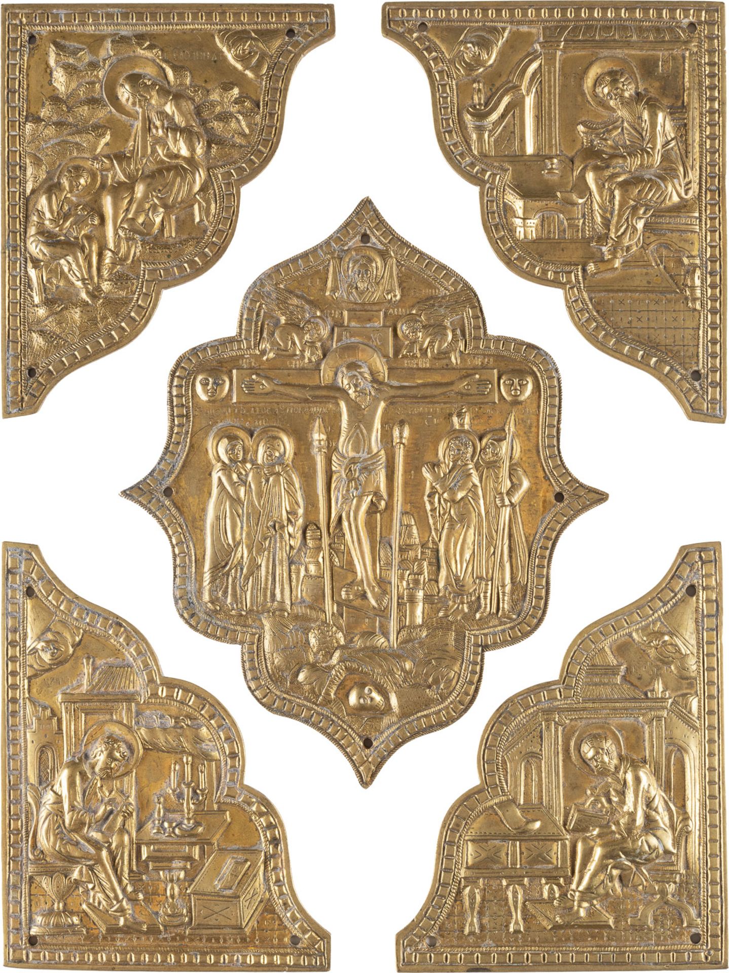 FIVE BRASS PLAQUES FROM A BOOK OF GOSPELS SHOWING THE CRUCIFIXION OF CHRIST AND THE FOUR