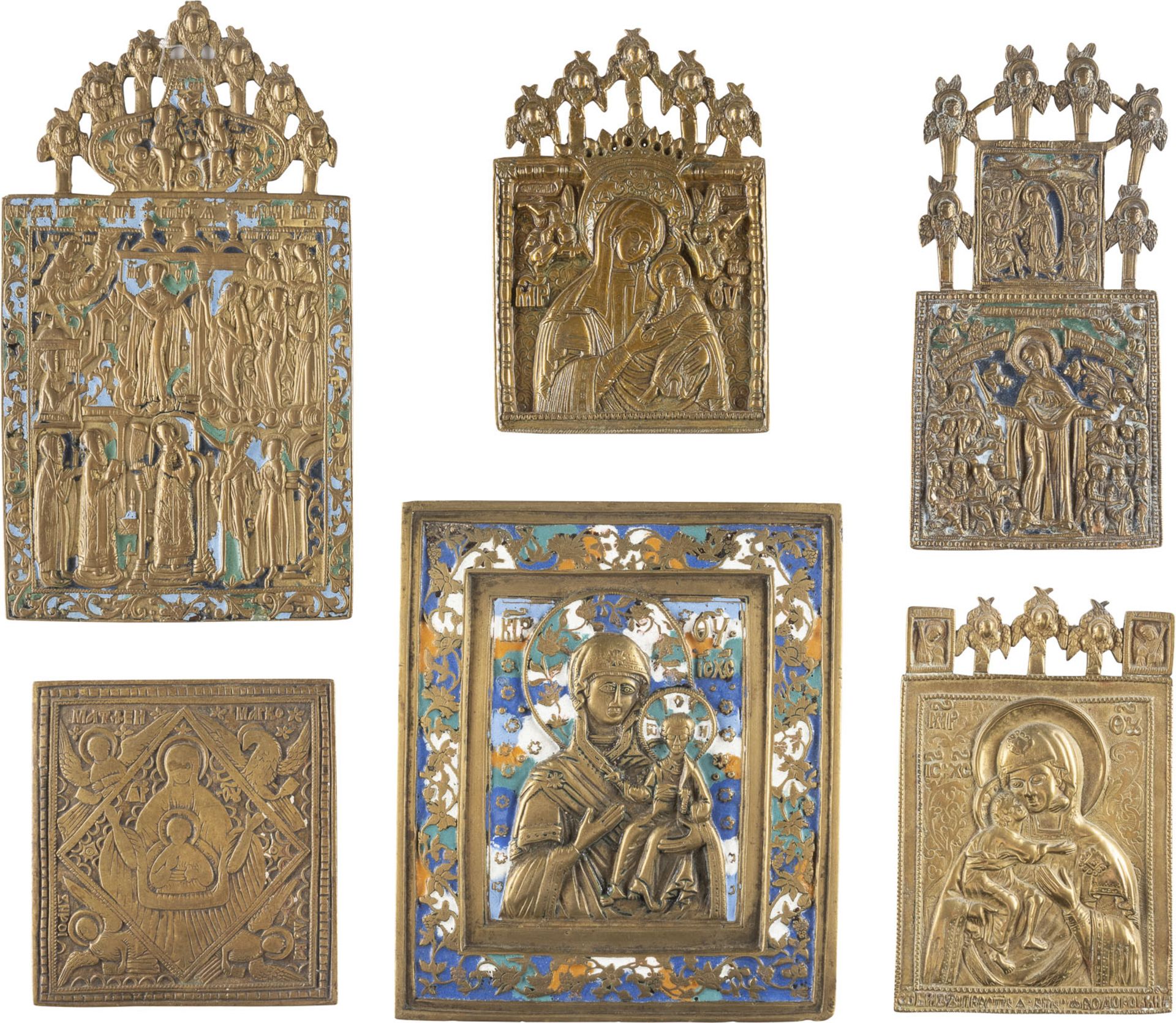 A COLLECTION OF SIX BRASS AND ENAMEL ICONS SHOWING IMAGES OF THE MOTHER OF GOD