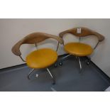 2x Yellow swivel chairs