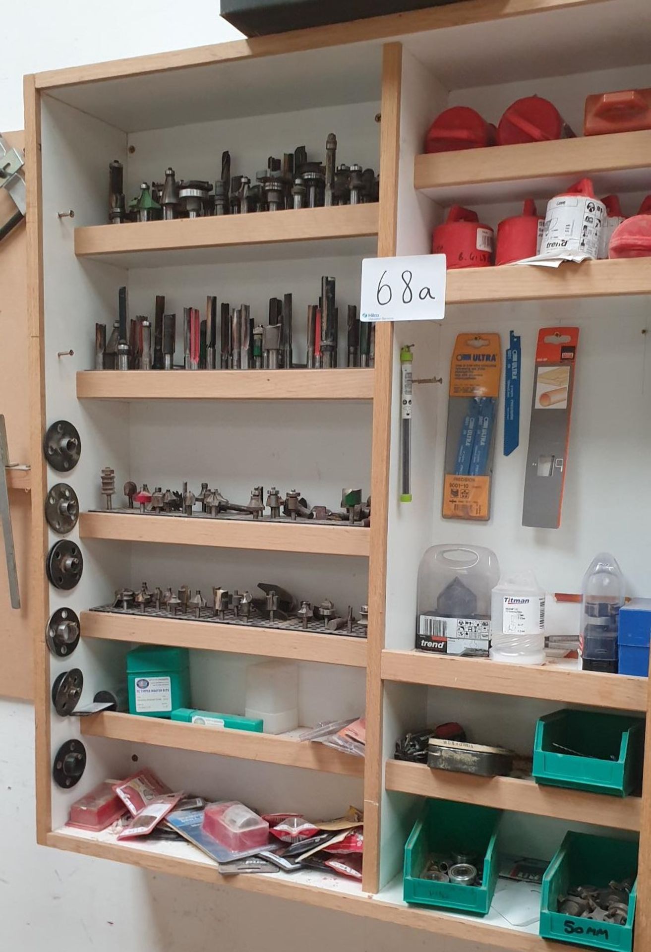 Qty: Contents of box on wall to include variety of Tipped Router Bits Viewing Recommended"