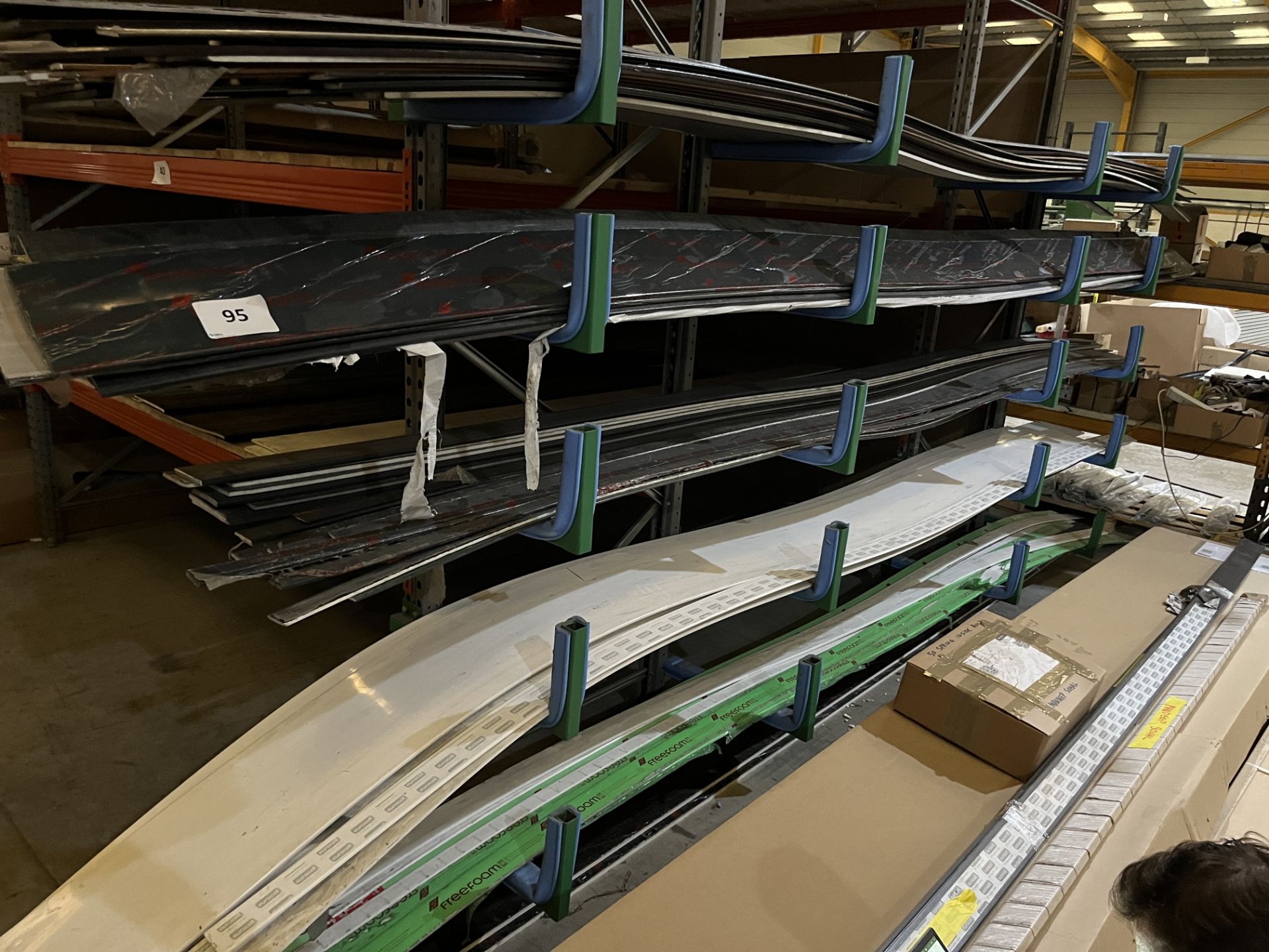 Quantity of Various Sized And Coloured PVC Flatboards On a Five Section Rack