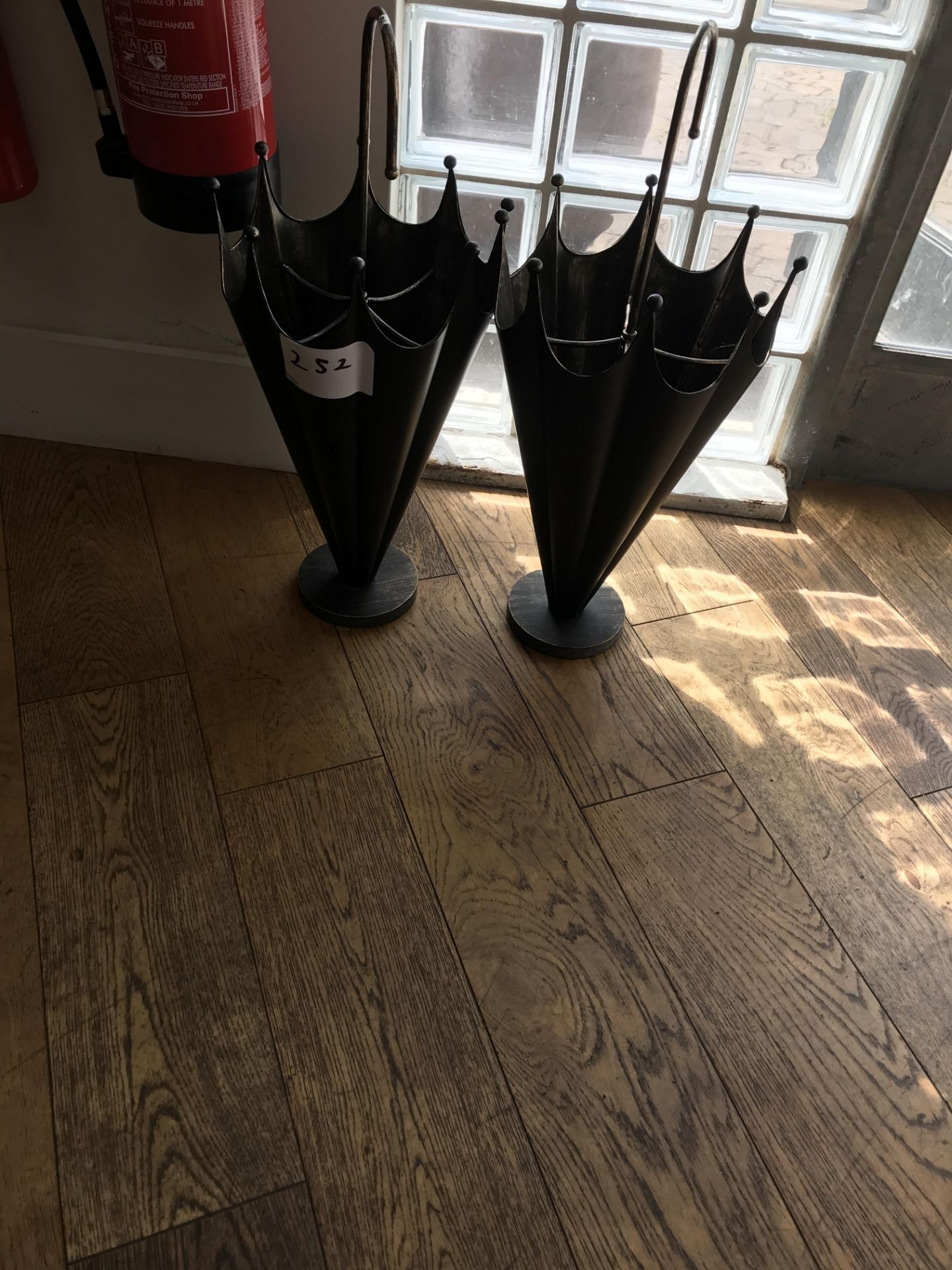 2, Shaped Metal Umbrella Stands As Lotted