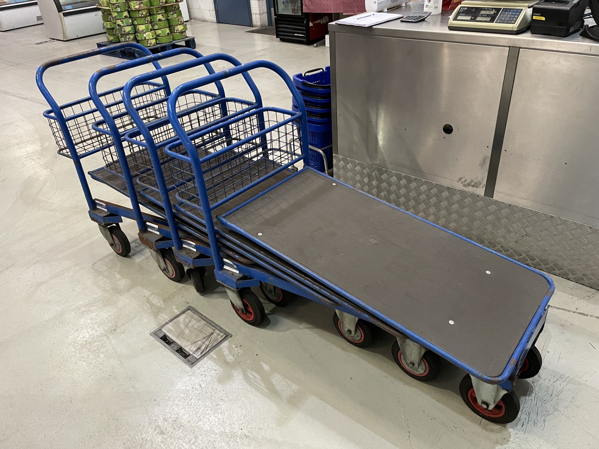 (4) Blue Nestable Cash and Carry Trolley As Lotted (Please Note That This Is A Representative Photog