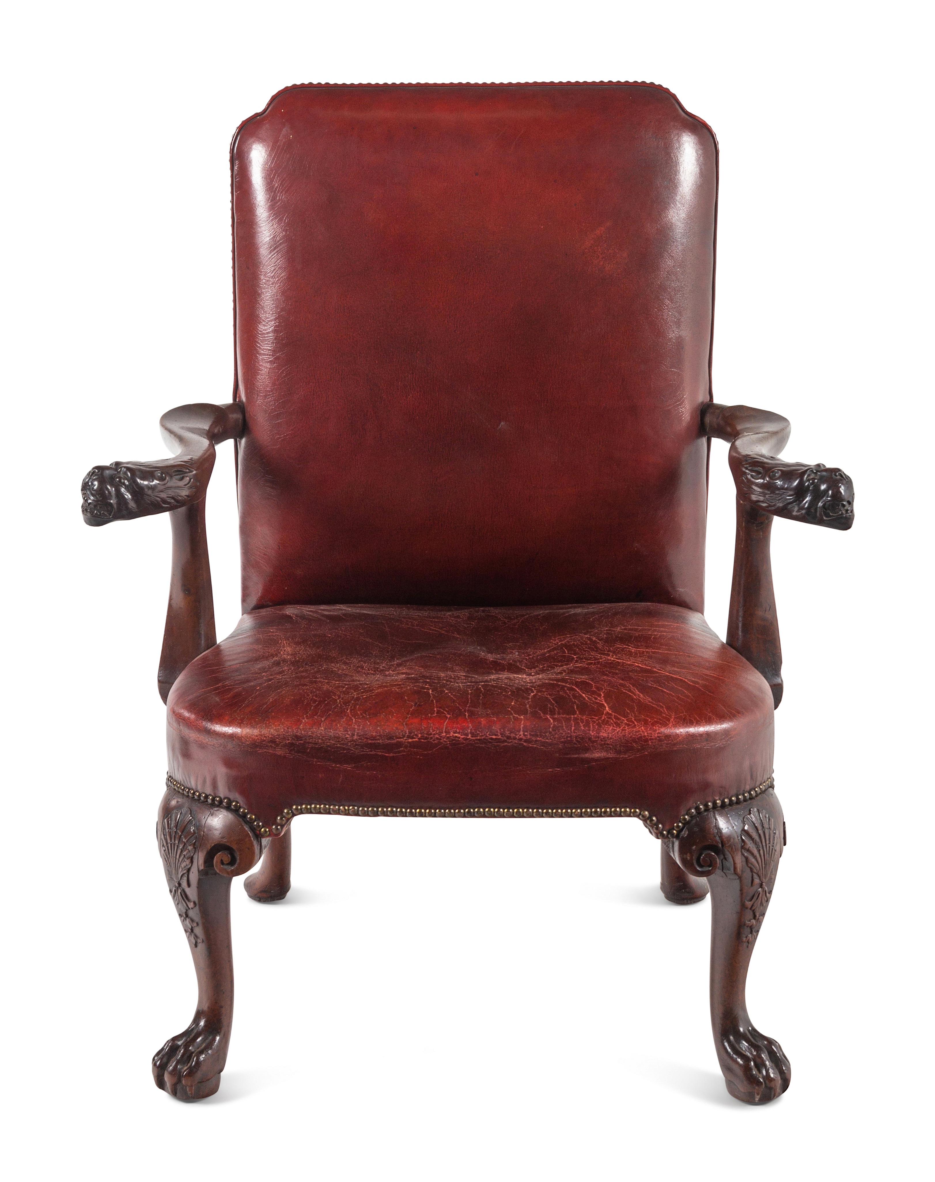 A George II Leather-Upholstered Carved Mahogany Library Chair