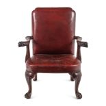 A George II Leather-Upholstered Carved Mahogany Library Chair