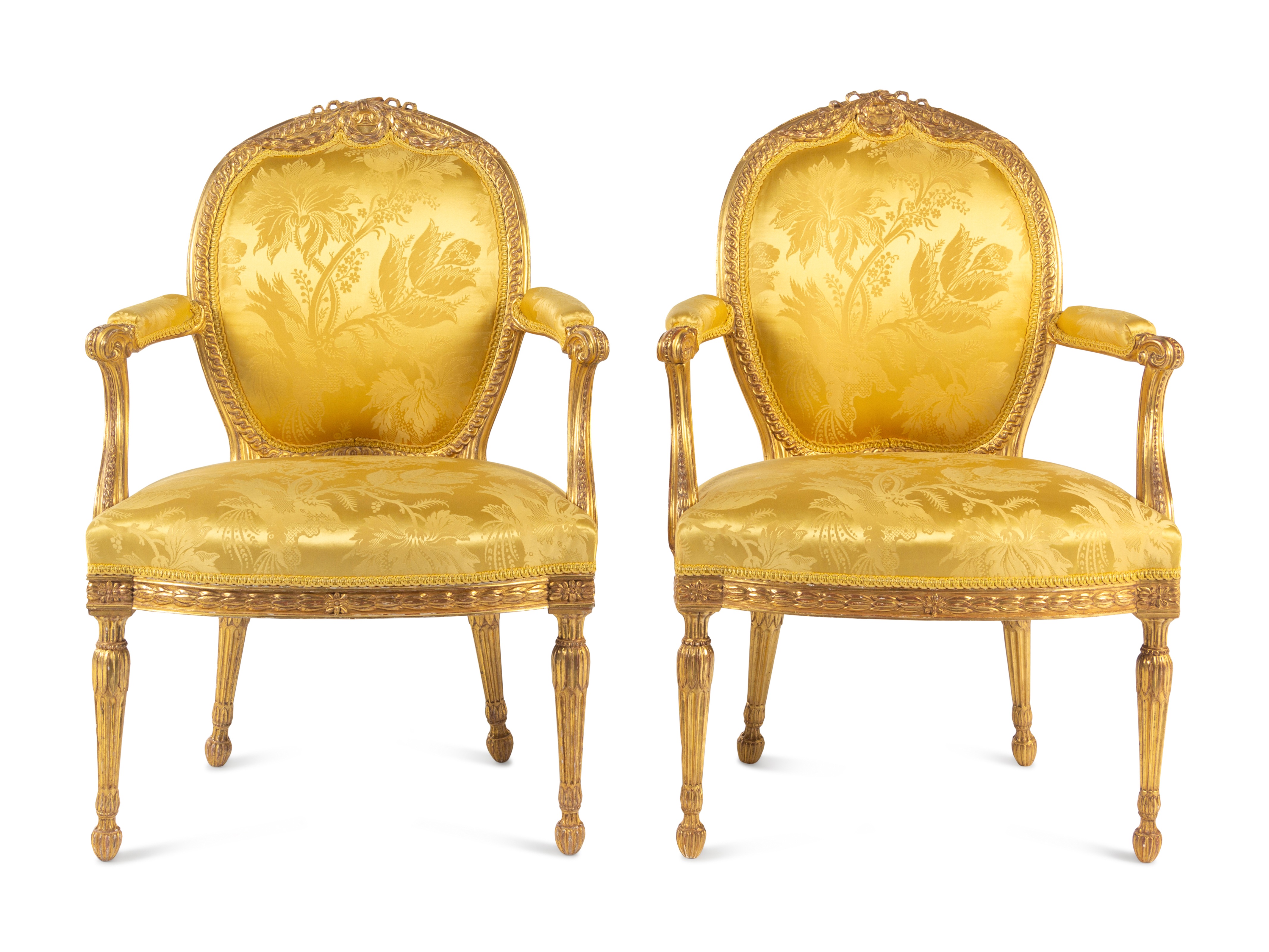 A Pair of George III Carved Giltwood Armchairs