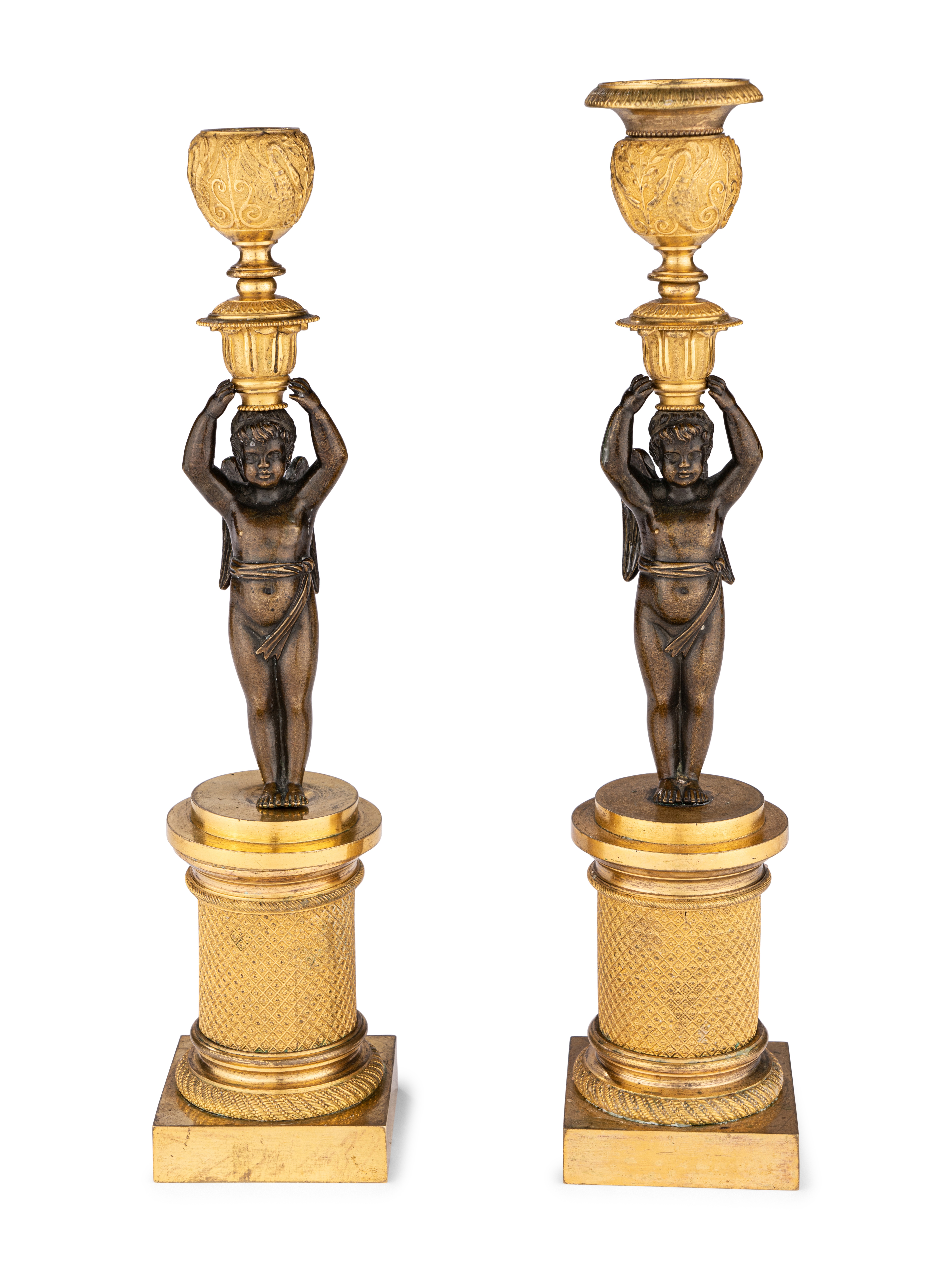 A Pair of Restauration Ormolu and Patinated Bronze Figural Candlesticks