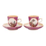 A Pair of Meissen Magenta-Ground Scenic Porcelain Teacups and Saucers