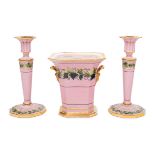 A Pair of Paris Porcelain Pink-Ground Vine-Decorated Candlesticks and a Jardiniere