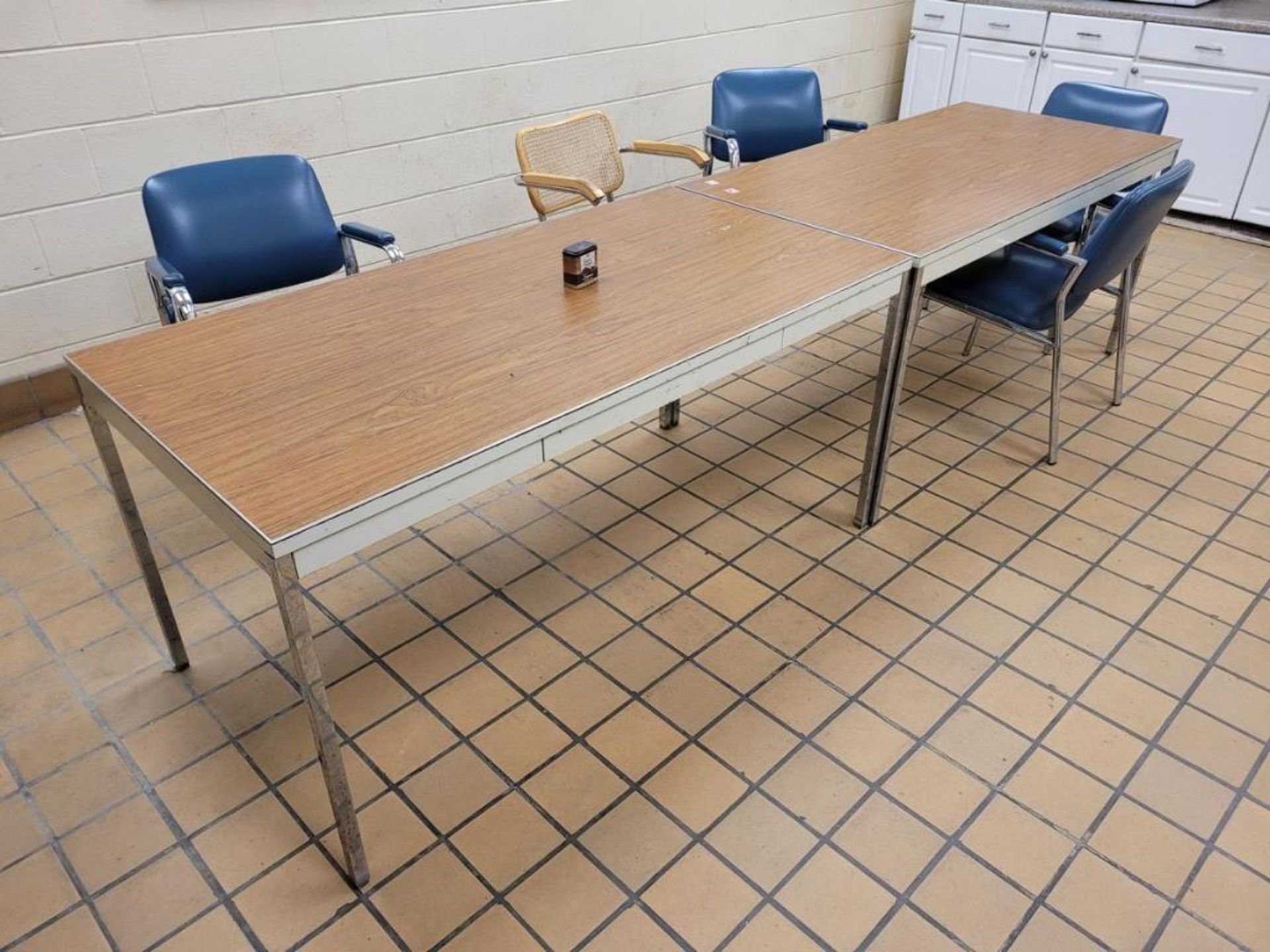 Remaining Contents of Lunch Room: (2) Tables, (8) Chairs, (2) Microwaves, (1) Refrigerator