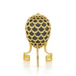 Adler, ornamental egg hematite covered by a pine cone pattern in 18K gold, on its base, set with rou