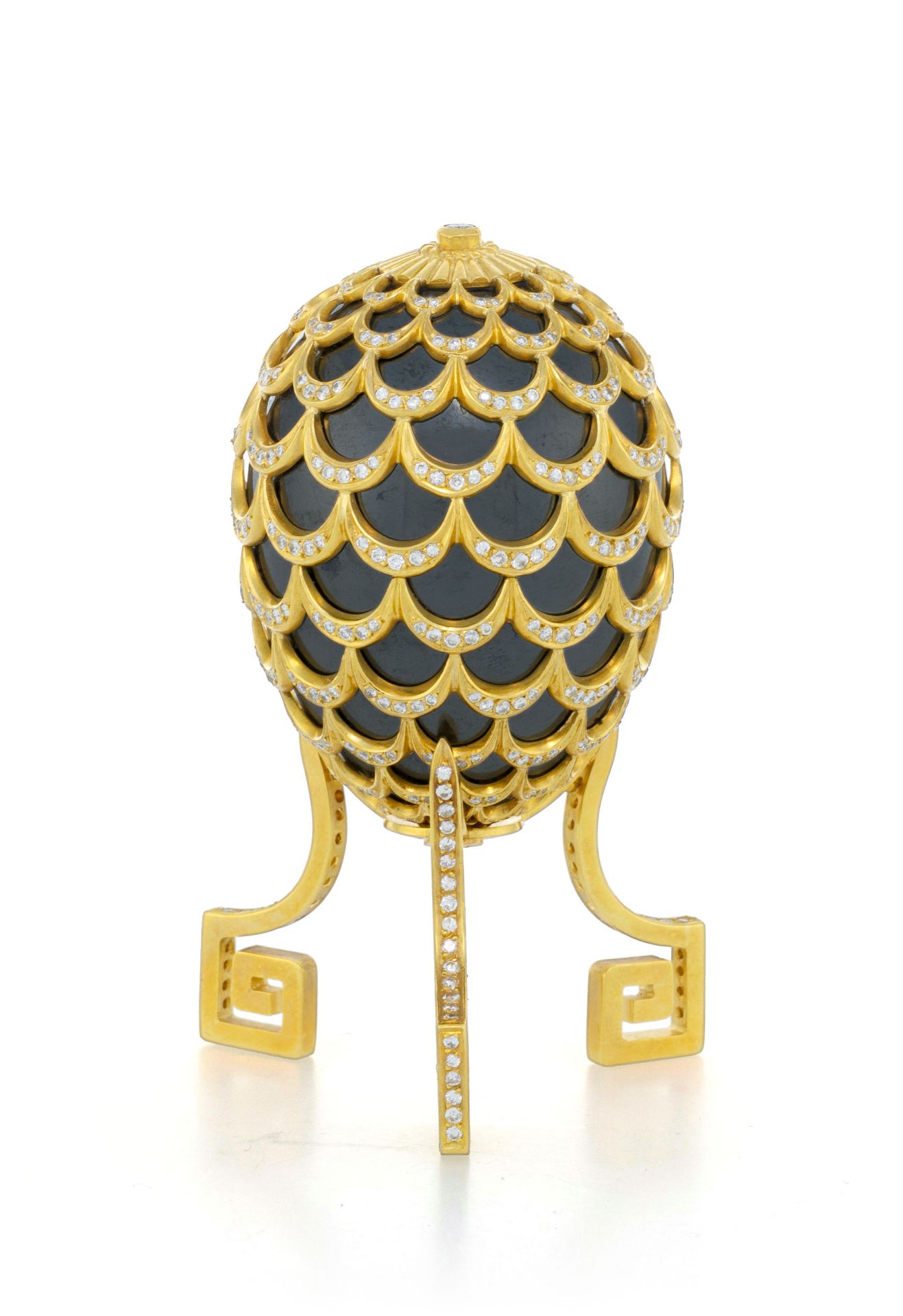 Adler, ornamental egg hematite covered by a pine cone pattern in 18K gold, on its base, set with rou