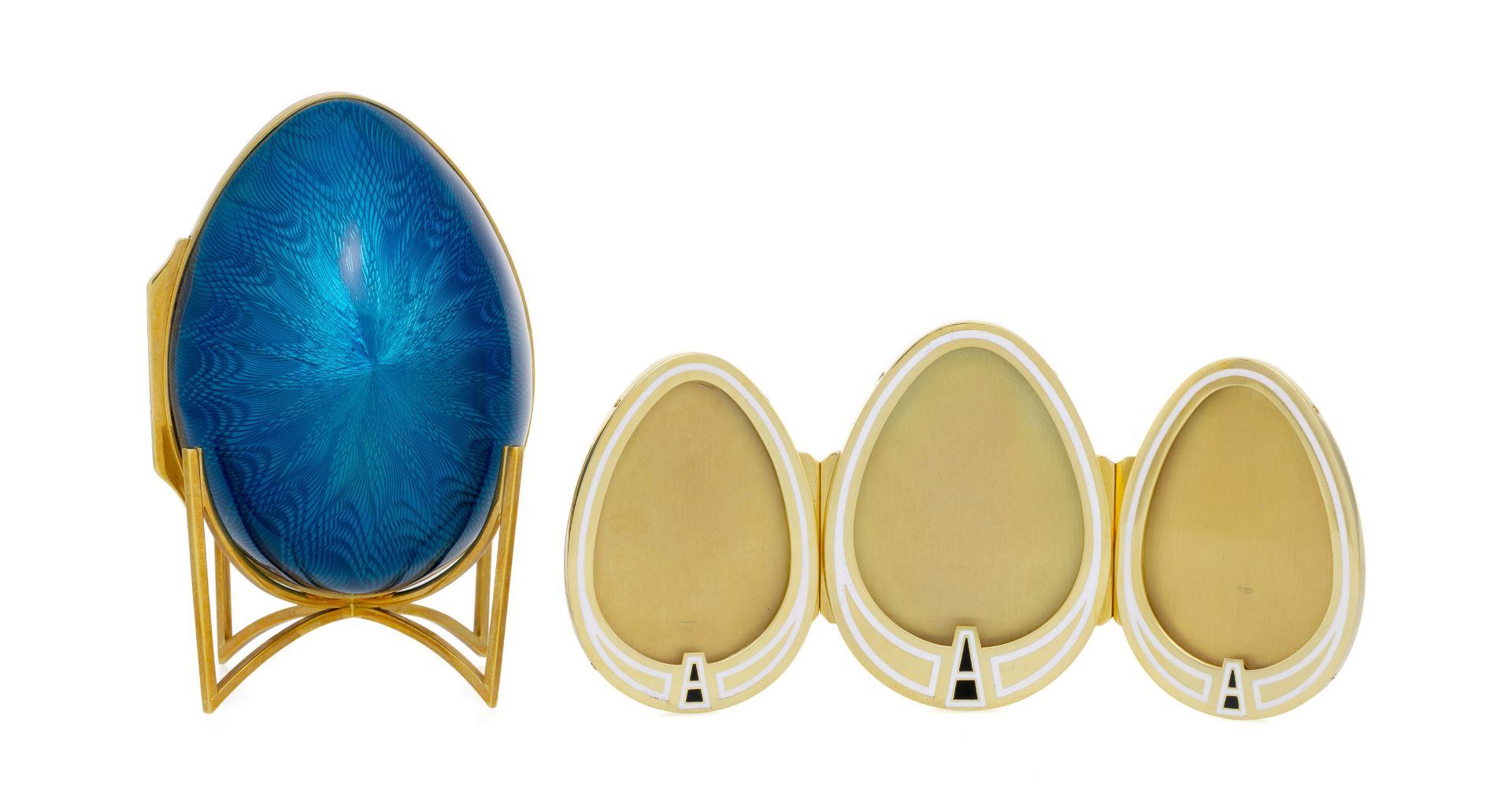 Asprey, attributed to, ornamental egg 18K gold and blue enamel, open up to reveal a triptych frame w