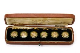 A SET OF SIX 9K GOLD AND ENAMEL BUTTONS