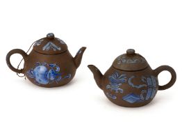 TWO SIMILAR ENAMELLED YIXING POTTERY TEAPOTS