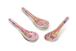 A SET OF EIGHT FAMILLE ROSE PINK GROUND SPOONS