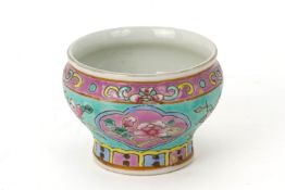 A TURQUOISE GROUND FAMILLE ROSE 'BABY' SPITTOON