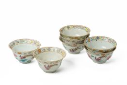 A MATCHED GROUP OF SEVEN FAMILLE ROSE 'PHEASANT' TEA BOWLS